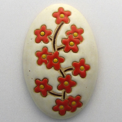 domed oval cabochon with blooming tree
