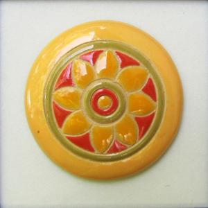 round cabochon, yellow and orange