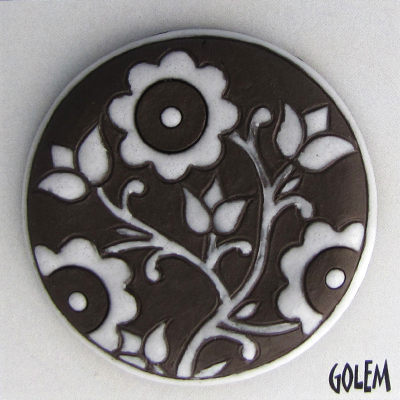 large round cabochon, white on dark clay