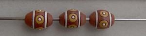 oval bead, yellow circles and white stri
