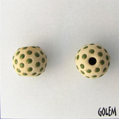 Dark green dots on tan