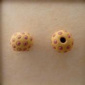 Purple dots on tan bead
