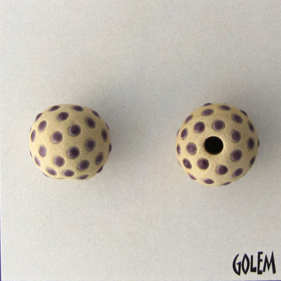 Purple dots on tan bead