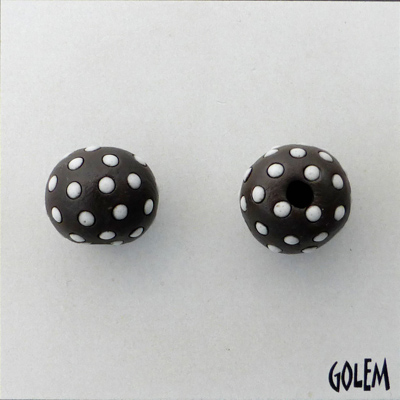 White polka dots on dark