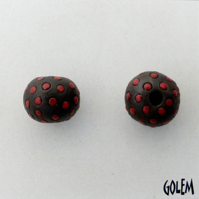 Red polka dots on dark