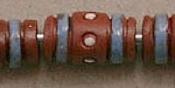 brown tube with blue stripes and white d