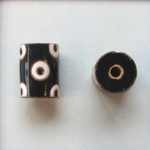 white circles on black tube