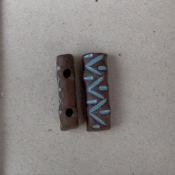 turquoise on dark, 2 hole bead