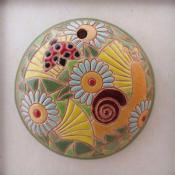 round pendant with snail and flowers