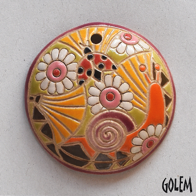 round pendant with snail and flowers