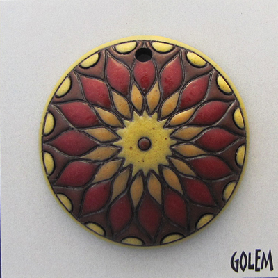 sun design in yellow & red on terracotta