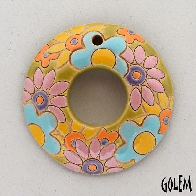 donut with pink/turquoise flowers