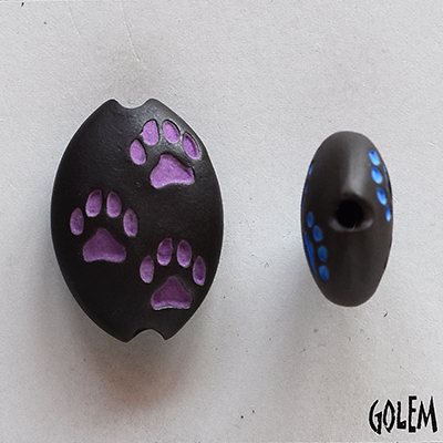 Paw Stamp, purple on dark, almond bead size M