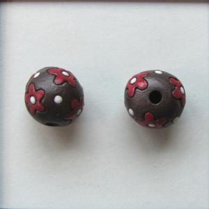 red flowers on dark clay