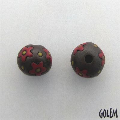 red flowers on dark clay