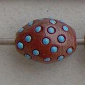 Blue dots on terracotta