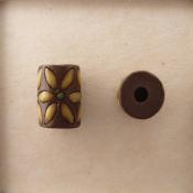 tube bead, yellow lieves on dark