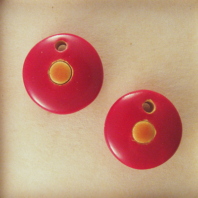 orange circle on red