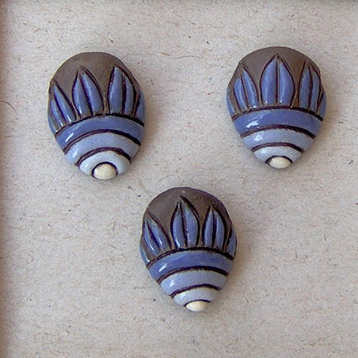 Blue flower on dark clay