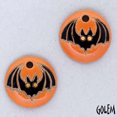 Bat on pumpkin background, charms