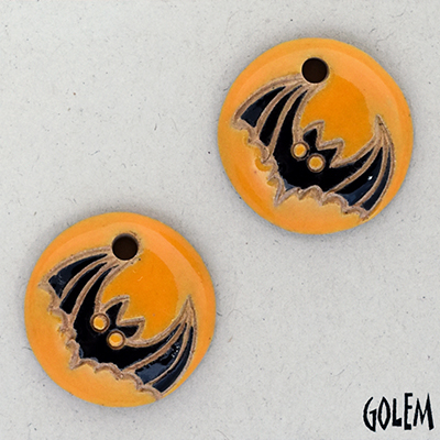 Bat on pumpkin background, charms