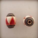 Oval, Blk strps, Red & Wht triangles