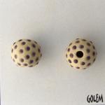 Purple dots on tan bead