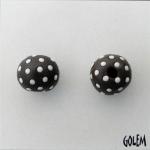 White polka dots on dark