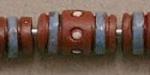 brown tube with blue stripes and white d