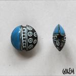 Small swirls, blue on dark clay, lentil size S