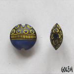 Small circles, blue on dark clay, lentil size S