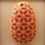 oval, coral lieves, yellow dots