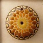 sun design in yellow, orange and tan