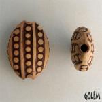 Hundred eyes, rust on off-white almond bead