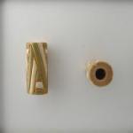green & white design on off white tube -