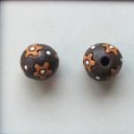 orange flowers on dark clay