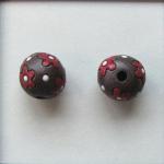 red flowers on dark clay