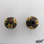 yellow flowers on dark clay