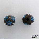 neon blue flowers on dark clay