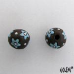 turquoise flowers on dark clay