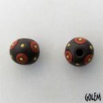 Coral circles on dark clay, round bead