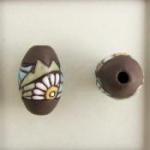 Dark oval bead, flowers