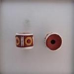 Yellow circles/white lines on terracotta