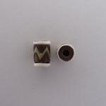 Green zigzag on dark tube bead