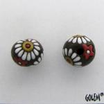 white daisies on dark clay