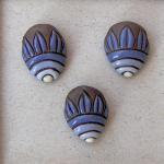 Blue flower on dark clay